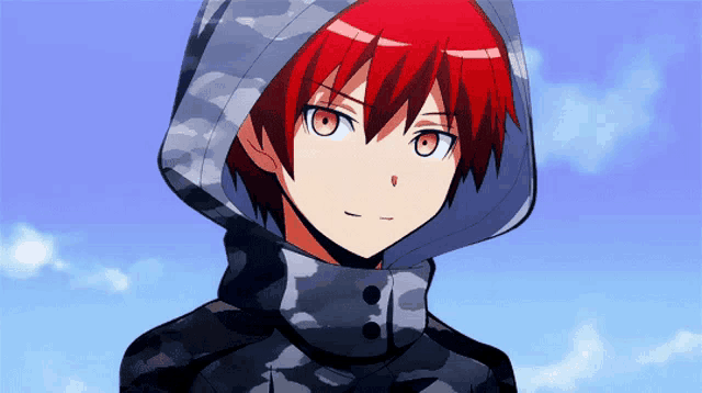 a boy with red hair is wearing a camouflage hoodie