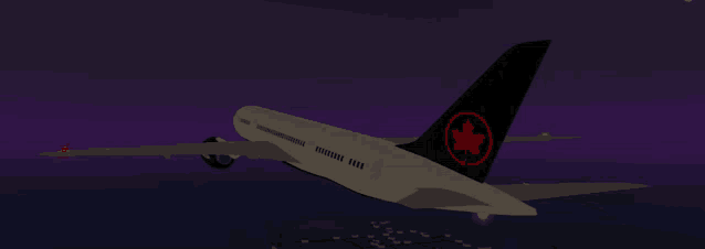 an airplane with a maple leaf on its tail