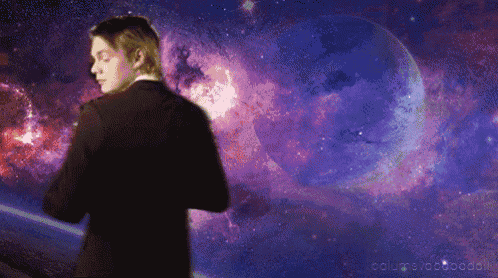 a man in a suit is standing in front of a galaxy and a planet with the words collapsvoodoo on the bottom right