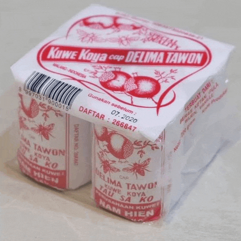 a package of kowe kova cap delima tawon sits on a white surface