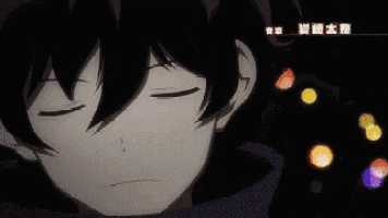 a close up of a person with blue eyes in the dark .