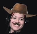 a woman wearing a cowboy hat and headphones is smiling .