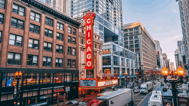 an aerial view of a busy city street with the chicago theater in the foreground