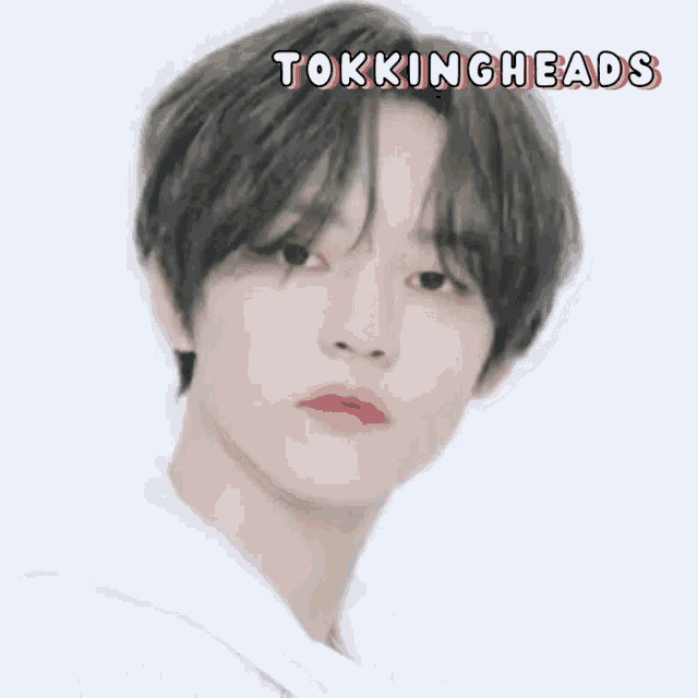 a close up of a young man 's face with the words tokingheads above him