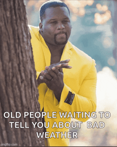 a man in a yellow suit is peeking out from behind a tree and says old people waiting to tell you about bad weather