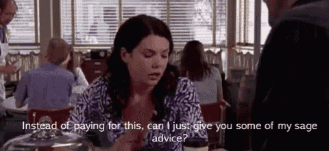 a woman is sitting at a table in a restaurant talking to a man and asking for advice .