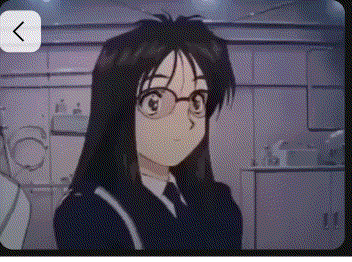 a girl wearing glasses and a suit is standing in a room looking at the camera .