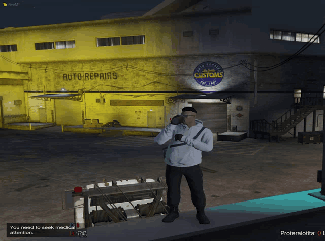 a man standing in front of a building that says auto repairs on it