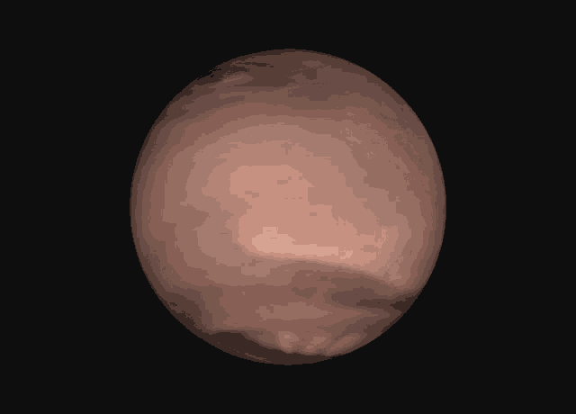 a brown sphere with a white triangle in the middle of it
