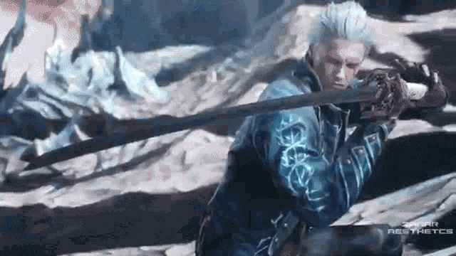 a man in a blue jacket is holding a sword in his hands .