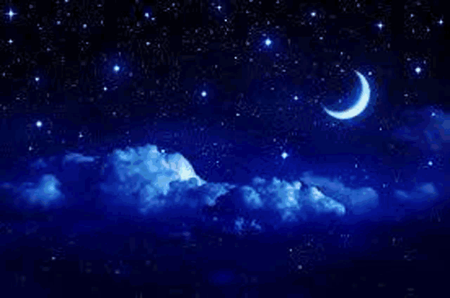 there is a crescent moon in the night sky with clouds .