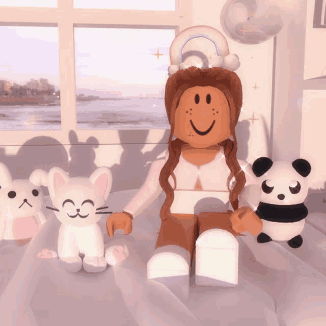 a girl sitting on a bed with stuffed animals including a panda bear and a cat