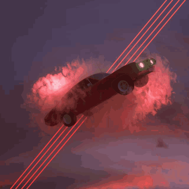 a red car is flying through the air with red smoke coming out of it