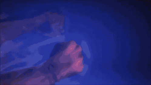 a bunch of fists are being thrown in the air against a blue background .