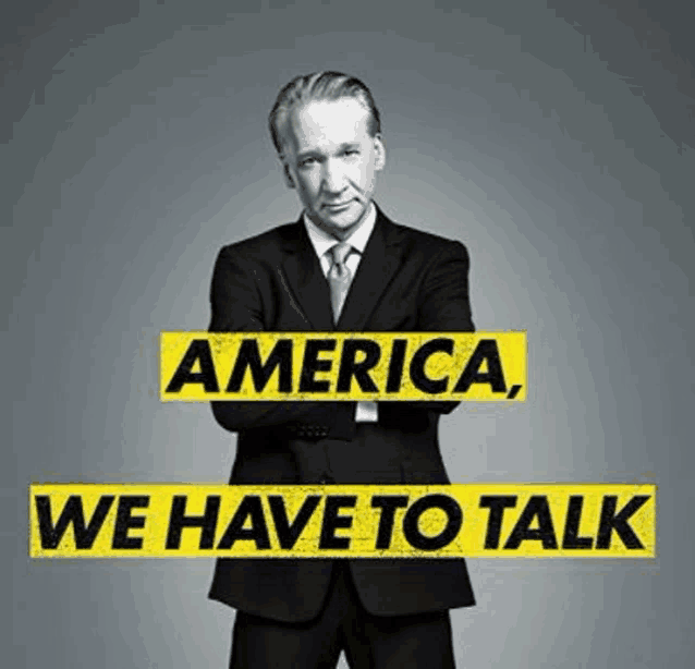 a man in a suit and tie is standing in front of a sign that says " america we have to talk "