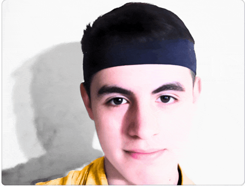 a young man with a headband on his head looks at the camera