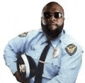 a police officer with a beard is holding a helmet .