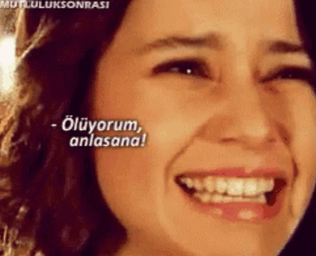 a close up of a woman 's face with the words ölüyorum anlasana written on it