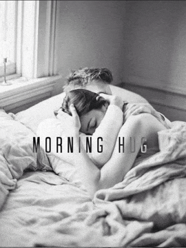 a black and white photo of a man and woman hugging with the words morning hug