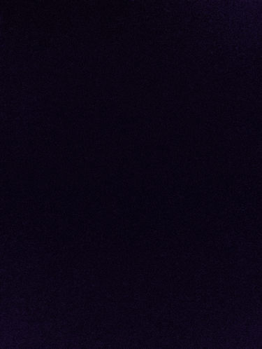 a close up of a dark purple background with a texture