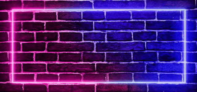 a brick wall with purple and blue neon lights shining on it .