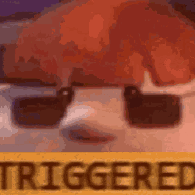 a close up of a person wearing sunglasses with the word triggered written on a yellow sign .