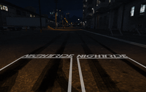 the word nightride is painted on a road