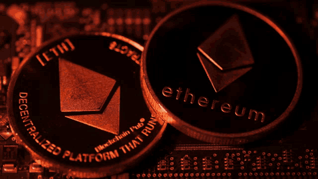 two ethereum coins on top of each other on a motherboard