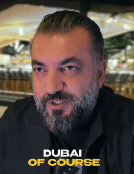 a man with a beard is featured on a poster for dubai of course