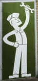 a cartoon of a man holding a wrench on a green door .