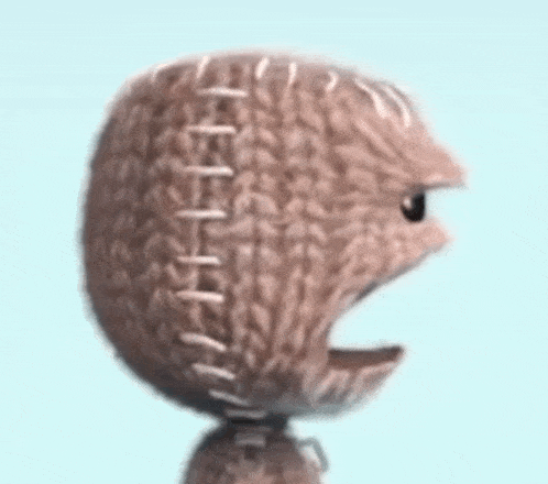 a close up of a knitted ball with stitching on it