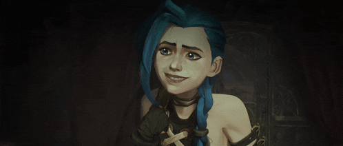 a girl with blue hair and braids is smiling in a dark room