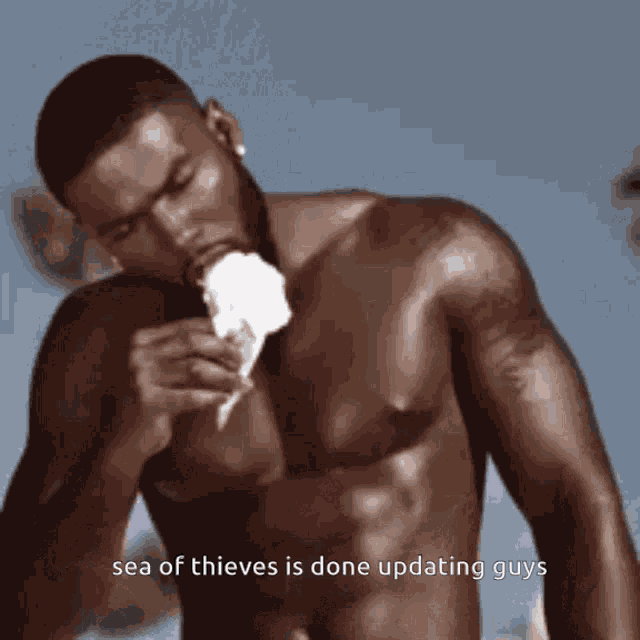 a shirtless man is eating an ice cream cone with the words sea of thieves is done updating guys below him