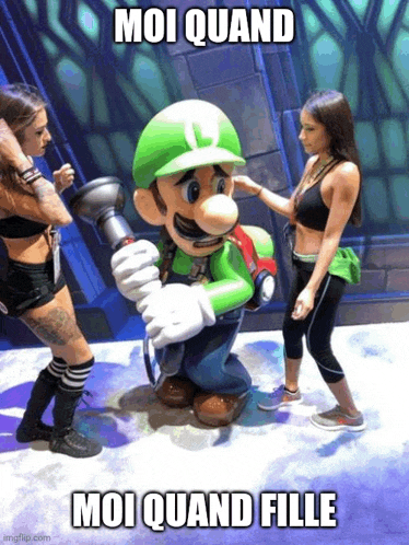 two women standing next to a statue of mario and luigi