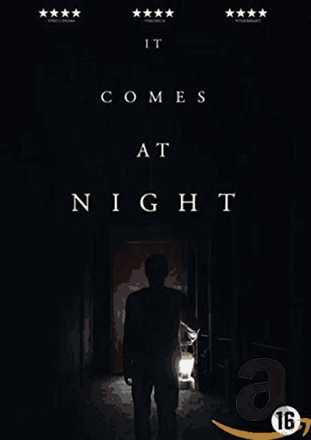 a movie poster for it comes at night shows a man standing in a dark hallway