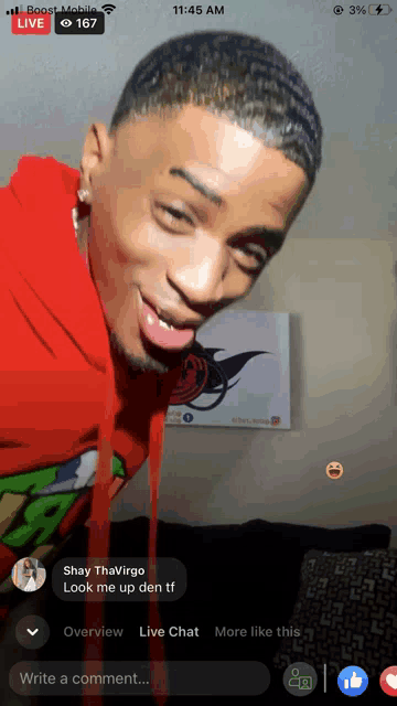 a man in a red hoodie is being viewed live on facebook