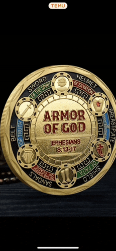 a gold coin with the words " armor of god " on it