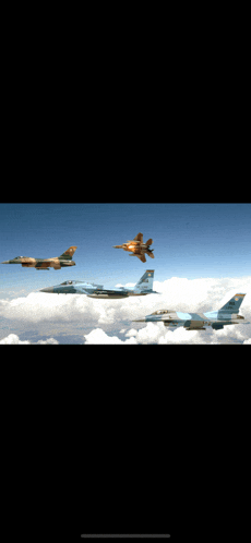 a group of fighter jets flying in formation with one having the letters f on its tail