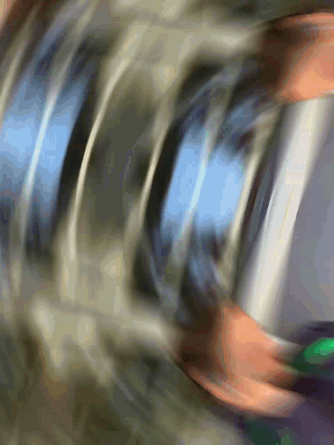a blurry picture of a person 's face with a blue and orange background