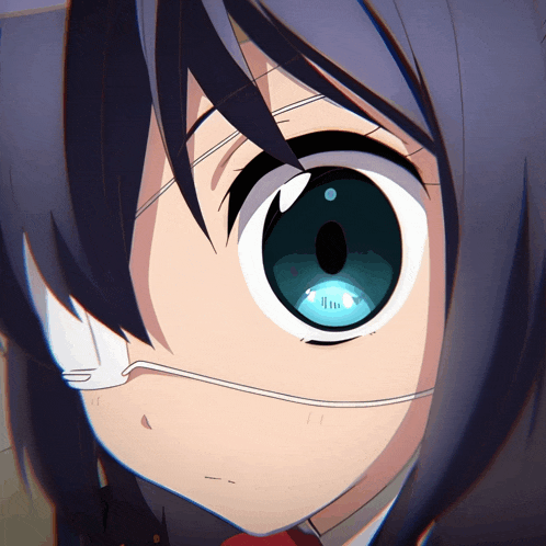 a close up of a girl 's eyes with a white bandage on one eye