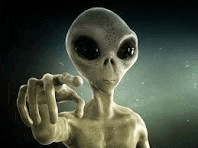 a close up of an alien pointing at the camera with his finger .