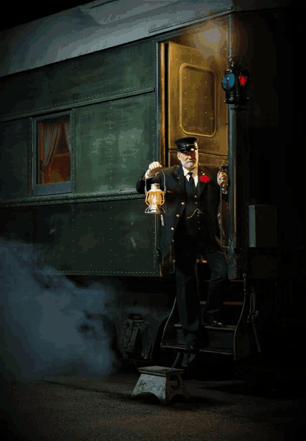 a man holding a lantern is standing in front of a train car