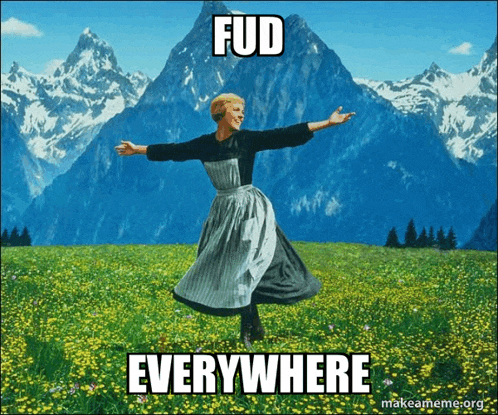 a woman is dancing in a field with the words fud everywhere