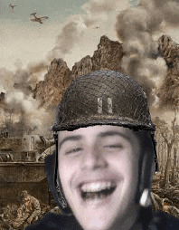 a man wearing a helmet and headphones is smiling in front of a painting of a battle scene .