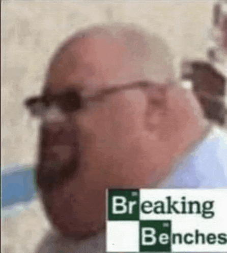 a bald man with glasses and a beard is wearing a breaking benches logo on his face .