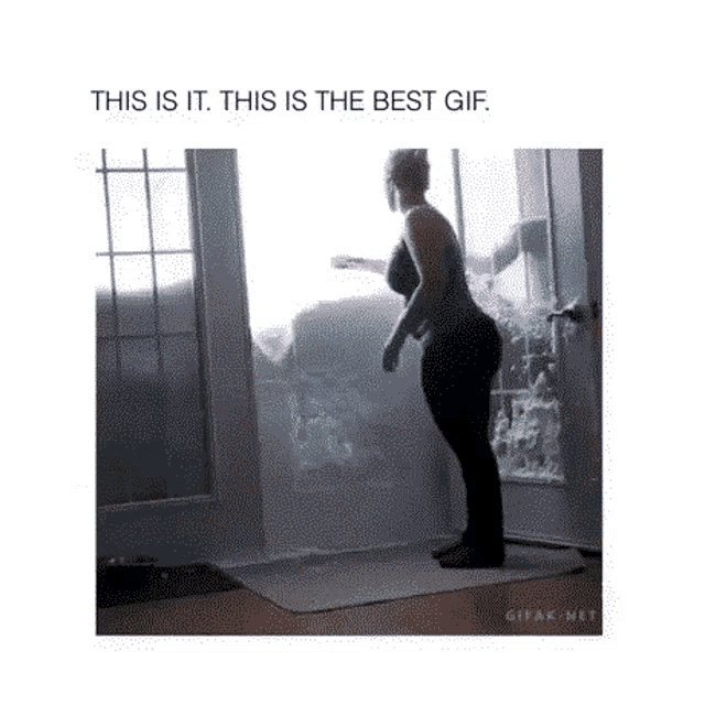 a gif of a woman standing in front of a window with the words this is it this is the best gif below her