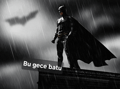 a black and white photo of a batman standing in the rain with the caption bu gece batu