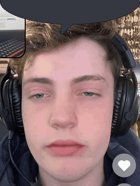 a man wearing headphones has a speech bubble over his head