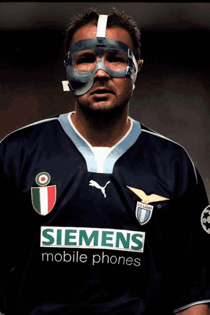 a man wearing a mask and a siemens mobile phone jersey