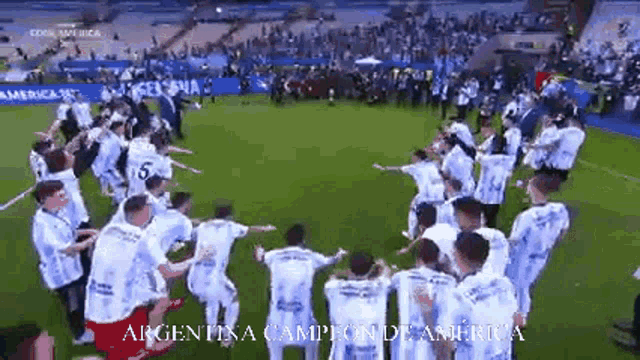 a group of soccer players are dancing on a field with the words argentina campione de america on the bottom